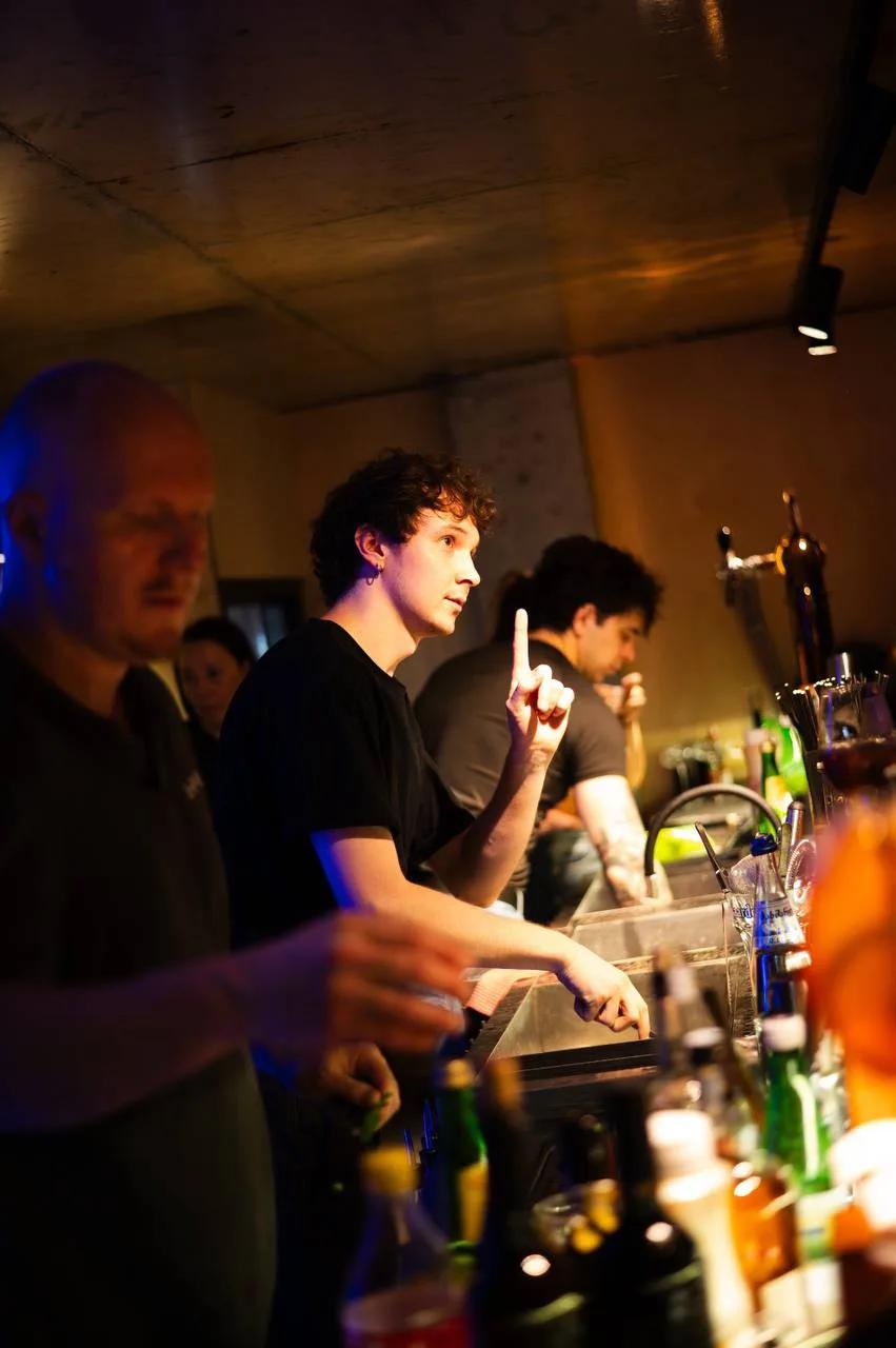 Bartenders at work behind the counter at LEVEL Beach Batumi
