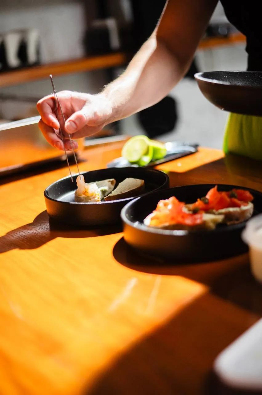 A chef plates appetizers at LEVEL Beach bar on Batumi New Boulevard